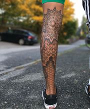 Geometric half legsleeve tattoo