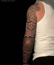Whole full arm tattoo sleeve with geometric patterns and mandalas.