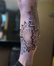 Mandala dotwork tattoo for girl. Fibonacci tattoo flower style.