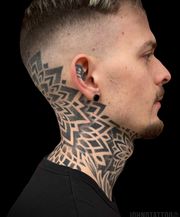 Symmetry mandala tattoos on neck and throat. Dotwork artist.